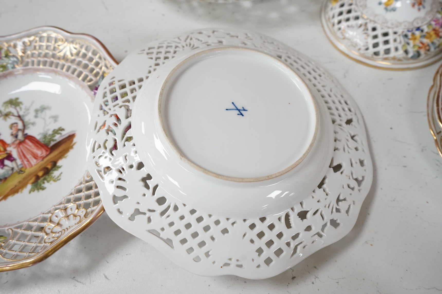 A Dresden porcelain part tea set together with reticulated side plates, largest 26cm in diameter